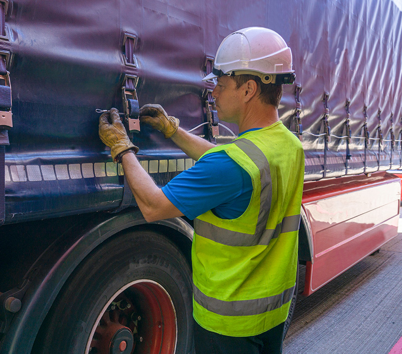 Walking floor HGV trailer departing a UK waste transfer station